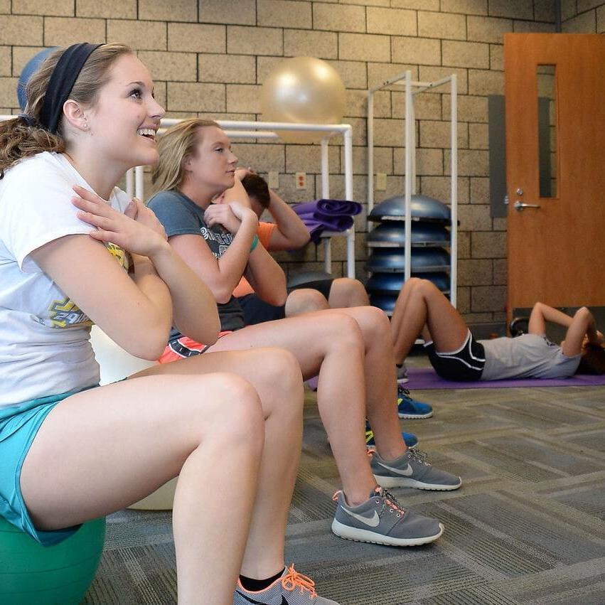 A group of students working out in the gym